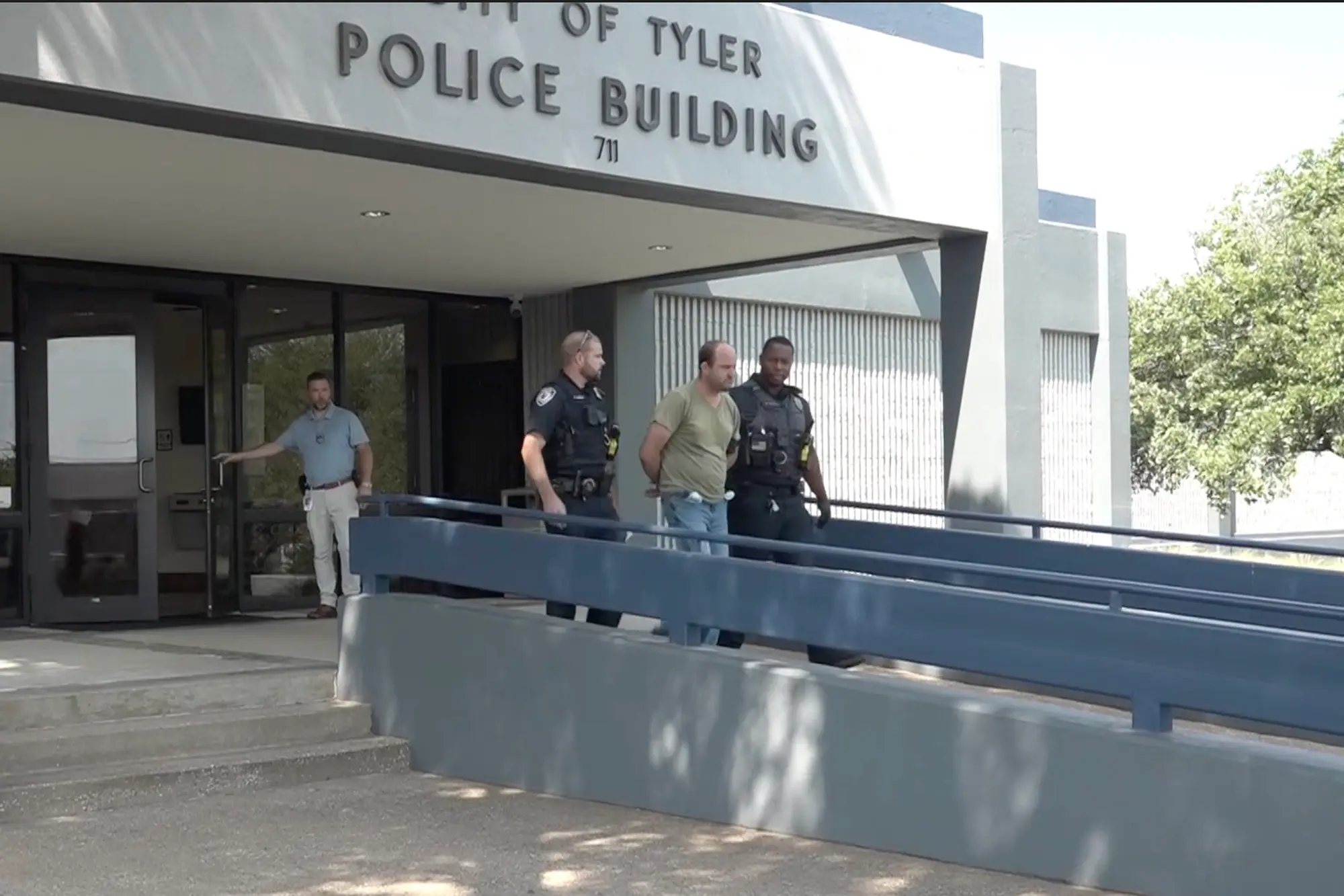 Wesley Worl escorted from the City of Tyler Police building
